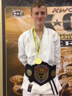 Blake, a foster child with Birmingham Children's Trust, poses with his gold medal as he becomes British Champion